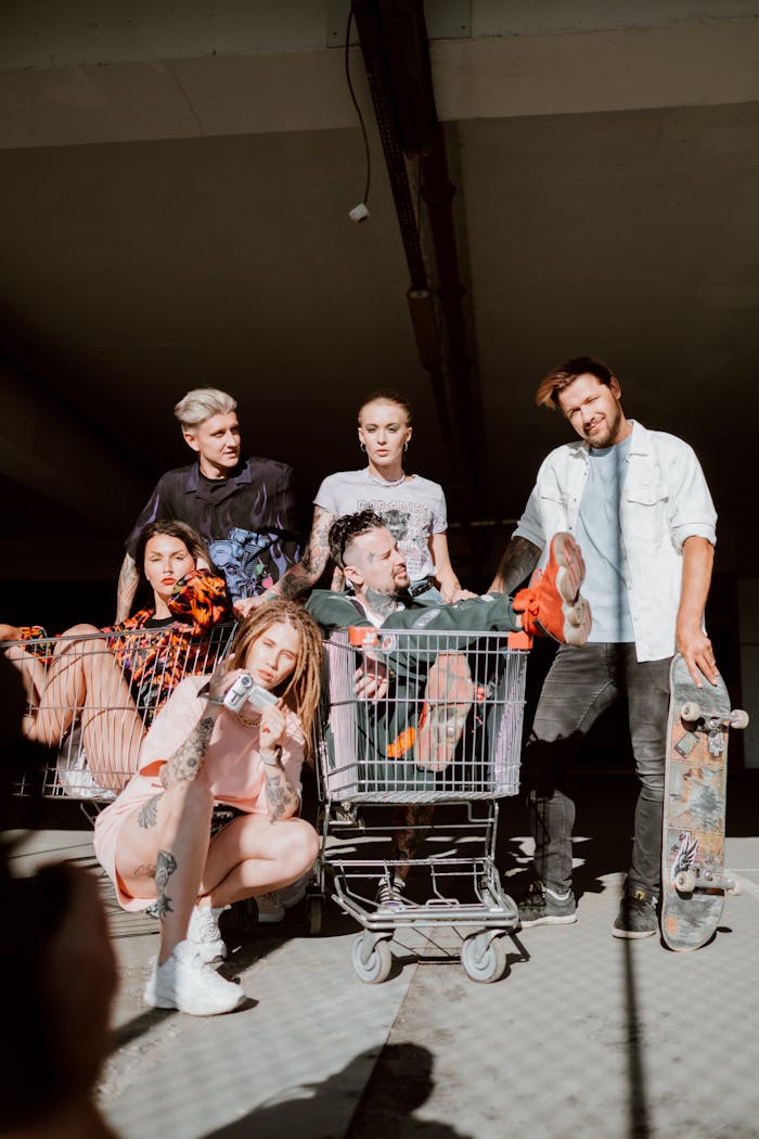 about-01 A group of young friends playing with shopping carts in a parking lot, expressing joy and friendship.